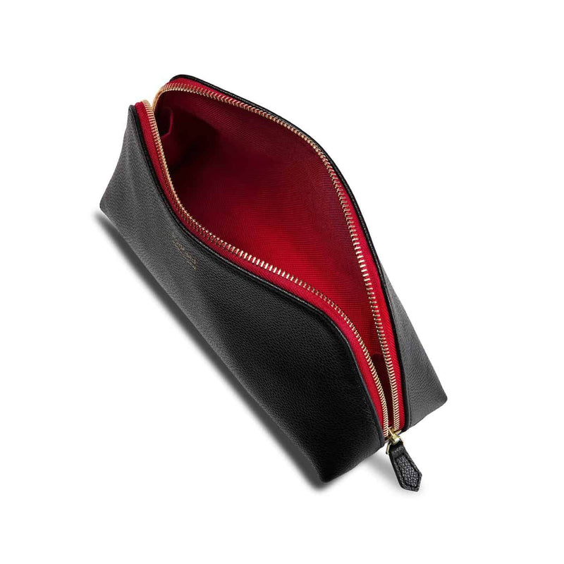 Padfield Made in England British Luxury black Leather Cosmetic Pouch with red colour pop zipper and waterproof red lining Best of British designer luxury leather travel accessories 
