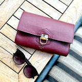 British made luxury burgundy leather clutch bag Made in England designer leather handbag